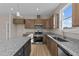 Modern kitchen with granite countertops and stainless steel appliances at 145 Brookhaven Dr, Spring Hope, NC 27882