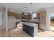 Modern kitchen with granite countertops, island, and stainless steel appliances at 145 Brookhaven Dr, Spring Hope, NC 27882