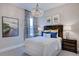 Cozy bedroom with a dark wooden bed frame and tasteful artwork at 149 Brandy Ml, Pittsboro, NC 27312
