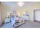 Bedroom with en-suite bath, featuring a floral comforter and white dresser at 149 Brandy Ml, Pittsboro, NC 27312
