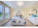 Bedroom with en-suite bath, featuring a floral comforter and white dresser at 149 Brandy Ml, Pittsboro, NC 27312