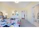 Bedroom with en-suite bath, featuring a floral comforter and white dresser at 149 Brandy Ml, Pittsboro, NC 27312