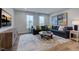 Bright bonus room with sectional sofa, flat screen TV, and hardwood floors at 149 Brandy Ml, Pittsboro, NC 27312