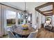 Charming breakfast nook boasts a round wooden table and views of the backyard at 149 Brandy Ml, Pittsboro, NC 27312