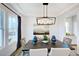 Elegant dining room with a dark wood table and statement lighting at 149 Brandy Ml, Pittsboro, NC 27312