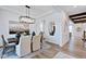 Dining room with dark wood table, chandelier, and view to living room at 149 Brandy Ml, Pittsboro, NC 27312