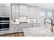 Modern kitchen features gas cooktop and white shaker cabinets at 149 Brandy Ml, Pittsboro, NC 27312