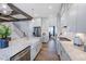 Open concept kitchen with granite countertops, gas range, and white cabinetry at 149 Brandy Ml, Pittsboro, NC 27312