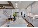 Bright kitchen boasts an island with seating, stainless steel appliances, and white cabinets at 149 Brandy Ml, Pittsboro, NC 27312