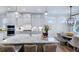 Modern kitchen with large island, stainless steel appliances, and white cabinets at 149 Brandy Ml, Pittsboro, NC 27312