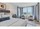Main bedroom with large bed, sitting area, and window views at 149 Brandy Ml, Pittsboro, NC 27312