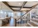 View of a living area and staircase with white railings and hardwood floors at 149 Brandy Ml, Pittsboro, NC 27312