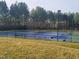 Well-maintained tennis courts nestled in a wooded area at 149 Brandy Ml, Pittsboro, NC 27312