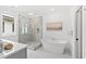 Modern bathroom with a freestanding soaking tub and glass shower at 2417 Mayview Rd, Raleigh, NC 27607
