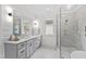 Spa-like bathroom with a double vanity, large shower, and soaking tub at 2417 Mayview Rd, Raleigh, NC 27607