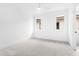 Well-lit bedroom, featuring a ceiling fan and carpet at 2417 Mayview Rd, Raleigh, NC 27607