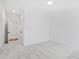 Spacious bedroom with neutral carpet and two windows at 2417 Mayview Rd, Raleigh, NC 27607