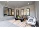 Relaxing covered patio features comfortable seating and a modern coffee table at 2417 Mayview Rd, Raleigh, NC 27607