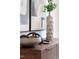 Stylish mid-century modern decor on a wooden dresser at 2417 Mayview Rd, Raleigh, NC 27607