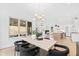 Bright dining area with light wood table and black chairs at 2417 Mayview Rd, Raleigh, NC 27607