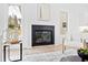Bright living room featuring fireplace, neutral decor, and hardwood flooring at 2417 Mayview Rd, Raleigh, NC 27607