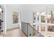 Bright hallway with hardwood floors and large windows at 2417 Mayview Rd, Raleigh, NC 27607