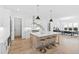 Bright kitchen features a large island with seating and modern cabinetry at 2417 Mayview Rd, Raleigh, NC 27607