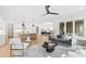 Open floorplan featuring a modern living room flowing seamlessly into the kitchen and dining areas at 2417 Mayview Rd, Raleigh, NC 27607