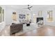 Bright living room featuring a modern fireplace, neutral decor, and hardwood flooring at 2417 Mayview Rd, Raleigh, NC 27607