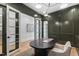 Office featuring french doors, dark green walls, and a modern desk at 2417 Mayview Rd, Raleigh, NC 27607