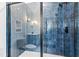 Modern shower with blue tile and glass enclosure at 2417 Mayview Rd, Raleigh, NC 27607