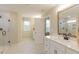 Bathroom featuring a glass enclosed shower, double sink vanity and modern fixtures at 271 White Azalea Way, Homesite 30, Benson, NC 27504