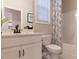 Clean bathroom with white vanity, toilet and bathtub at 271 White Azalea Way, Homesite 30, Benson, NC 27504