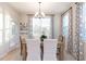 Bright dining room with wood table and neutral decor at 271 White Azalea Way, Homesite 30, Benson, NC 27504