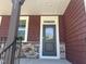 Inviting front entryway of home showing covered porch with stylish door, stonework, and exterior design elements at 271 White Azalea Way, Homesite 30, Benson, NC 27504