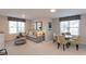 Bright Gathering room with a comfortable sectional sofa and dining table at 271 White Azalea Way, Homesite 30, Benson, NC 27504