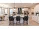 Island kitchen with quartz countertops and green tile backsplash at 271 White Azalea Way, Homesite 30, Benson, NC 27504