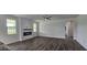 Bright and airy living room with a modern fireplace, wood floors, and plenty of natural light at 271 White Azalea Way, Homesite 30, Benson, NC 27504