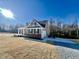 New home with a well-manicured lawn, attached garage, and convenient driveway at 294 White Azalea Way, Homesite 74, Benson, NC 27504