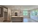 Bright kitchen featuring a central island, stainless steel appliances, and white cabinetry at 294 White Azalea Way, Homesite 74, Benson, NC 27504