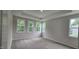 Spacious bedroom featuring carpeted floors and large windows that bring in natural light at 294 White Azalea Way, Homesite 74, Benson, NC 27504
