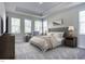 Spacious main bedroom with tray ceilings, large windows, and plush carpeting at 294 White Azalea Way, Homesite 74, Benson, NC 27504