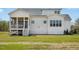 Home exterior featuring a screened porch, well-maintained lawn, and white trim at 3804 Cobbler View Way, Fuquay Varina, NC 27526