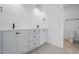 Bathroom featuring double sinks, white cabinets, and tile floors at 3804 Cobbler View Way, Fuquay Varina, NC 27526