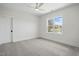 Bedroom featuring carpeted floors, a window, and white walls and trim at 3804 Cobbler View Way, Fuquay Varina, NC 27526