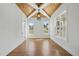 Dining area with hardwood floors, wood paneled ceiling, and contemporary light fixture at 3804 Cobbler View Way, Fuquay Varina, NC 27526