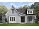 Charming gray brick home with dark roof, manicured lawn, and inviting curb appeal at 3804 Cobbler View Way, Fuquay Varina, NC 27526