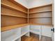 Walk-in pantry with custom-built shelving to provide ample storage space and organization at 3804 Cobbler View Way, Fuquay Varina, NC 27526