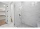 Glass shower with marble walls and mosaic tile floors at 3804 Cobbler View Way, Fuquay Varina, NC 27526