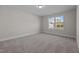 Well-lit bedroom featuring carpet and a window at 811 Pryor St, Mebane, NC 27302